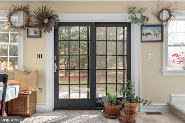 doorway to outside featuring plenty of natural light