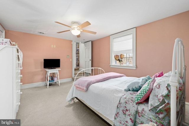 bedroom with light carpet and ceiling fan