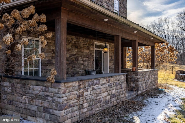 view of snow covered property entrance