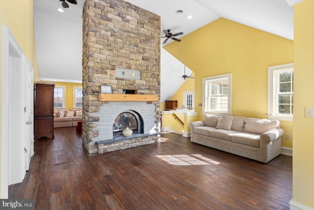 living room featuring a fireplace, dark wood-type flooring, high vaulted ceiling, and ceiling fan