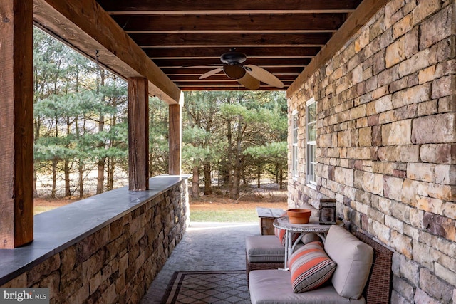 view of patio featuring ceiling fan