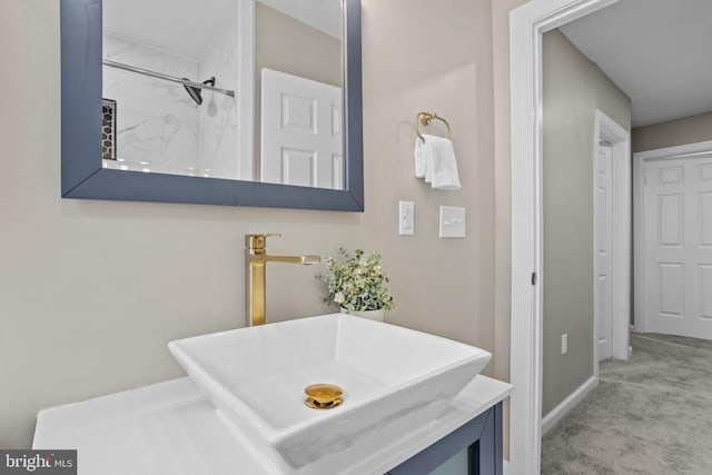 bathroom with vanity and walk in shower