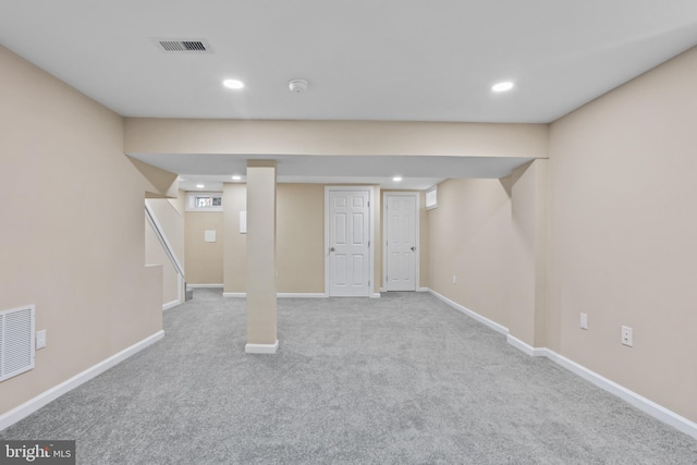 basement with light colored carpet