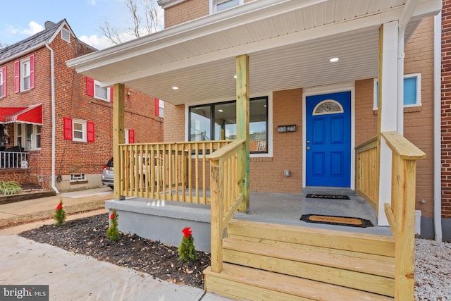 entrance to property featuring covered porch