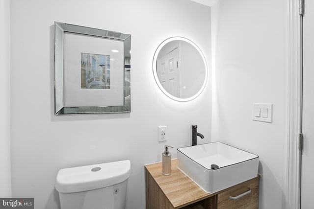 bathroom with vanity and toilet