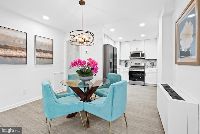 dining space featuring light hardwood / wood-style flooring