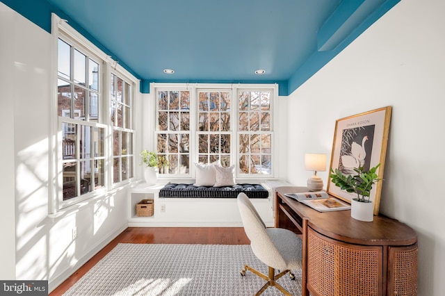 office space with wood-type flooring