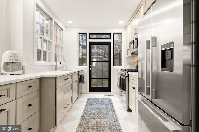 kitchen with sink and appliances with stainless steel finishes