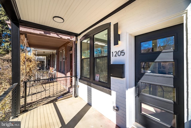 entrance to property with a porch