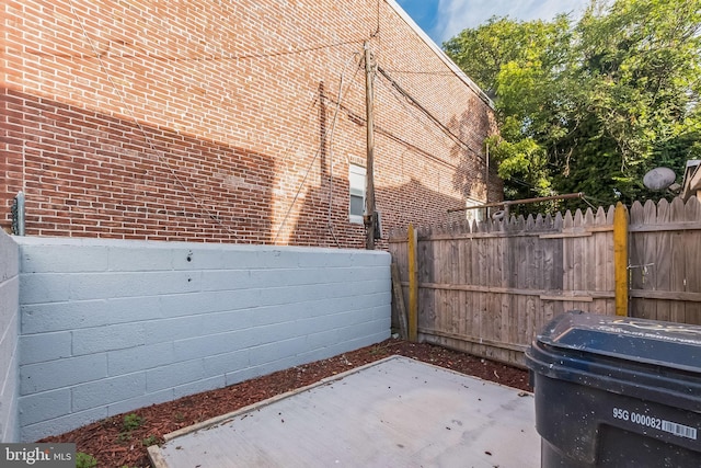 view of side of property featuring a patio area