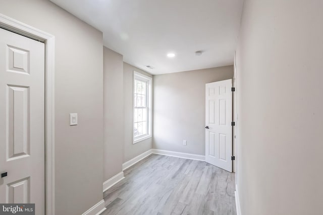 unfurnished room featuring light wood-type flooring