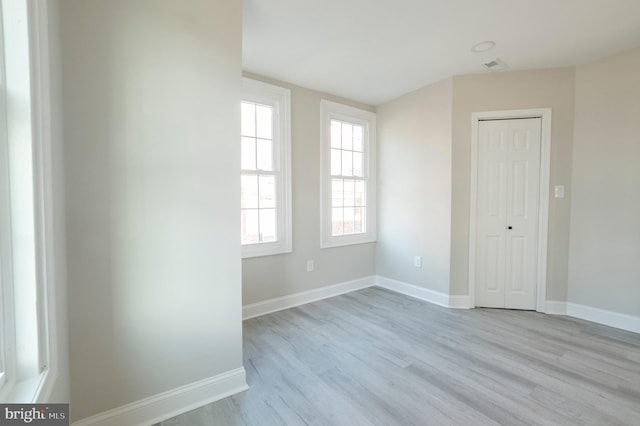 unfurnished room featuring light hardwood / wood-style flooring