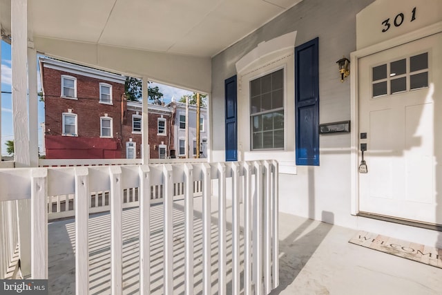 view of exterior entry featuring a porch