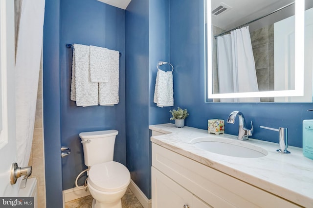 bathroom with vanity, toilet, and a shower with shower curtain