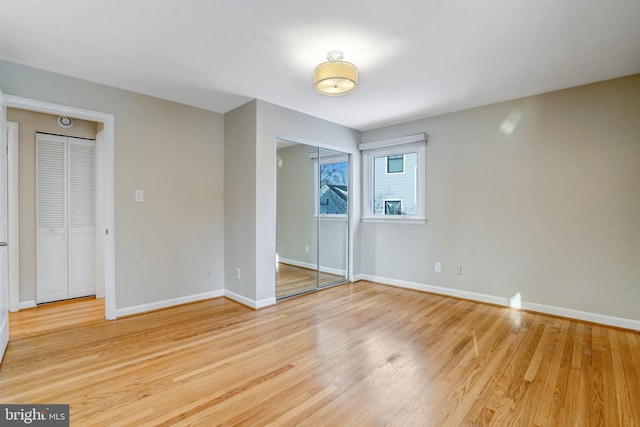 unfurnished bedroom with light wood-type flooring