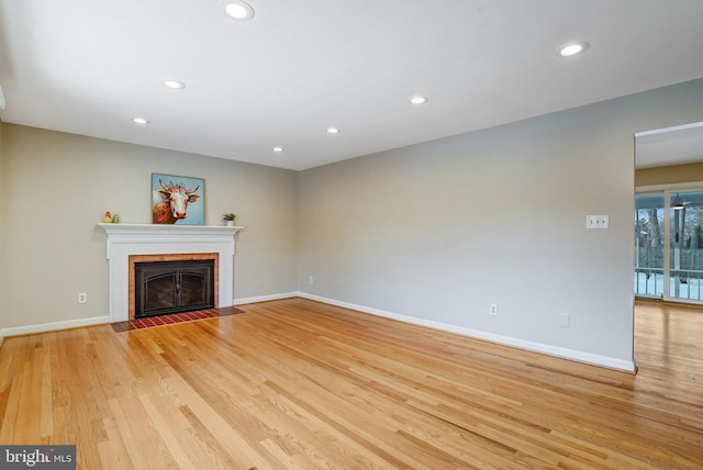 unfurnished living room with light hardwood / wood-style flooring