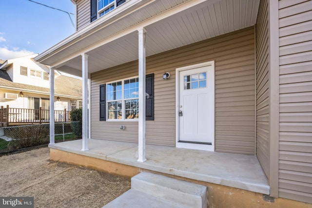 property entrance featuring covered porch