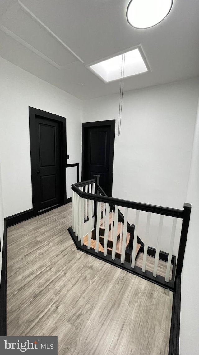 stairway featuring hardwood / wood-style floors