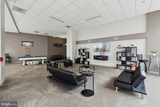 living room featuring carpet flooring, a drop ceiling, and billiards