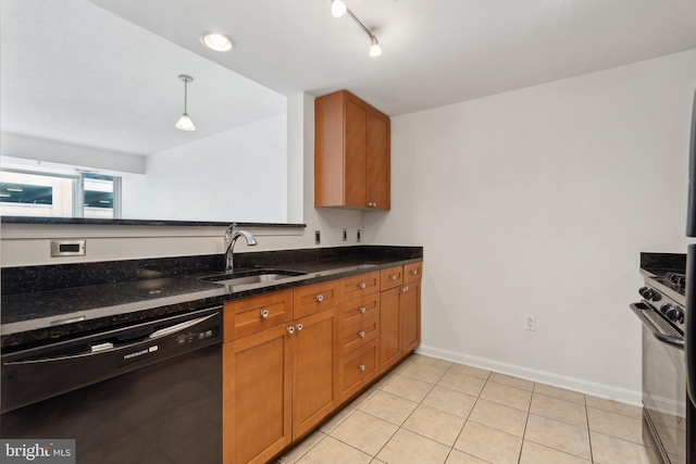 kitchen featuring sink, black appliances, pendant lighting, dark stone countertops, and light tile patterned flooring