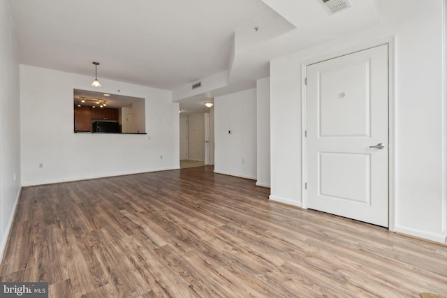 unfurnished living room featuring light hardwood / wood-style floors