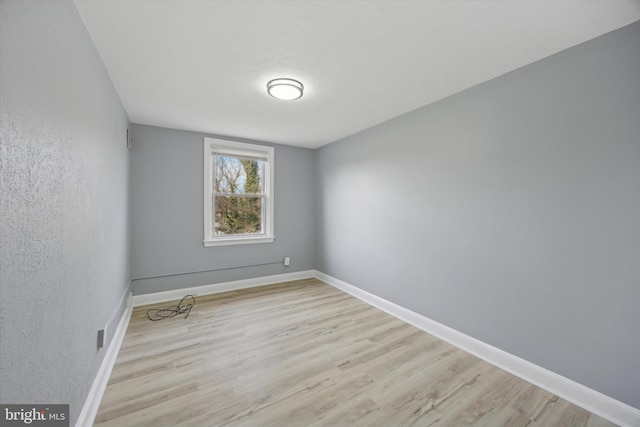 empty room with light wood-type flooring