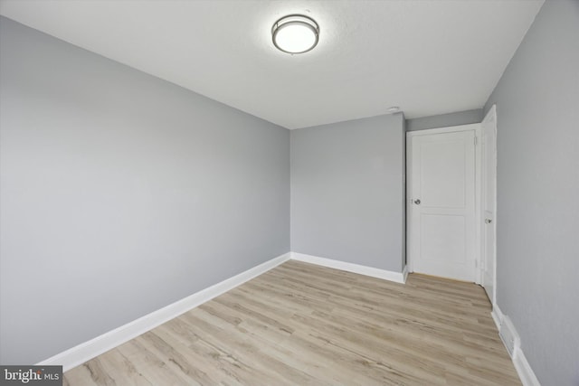 unfurnished room featuring light wood-type flooring