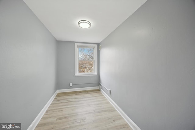 unfurnished room with light hardwood / wood-style flooring