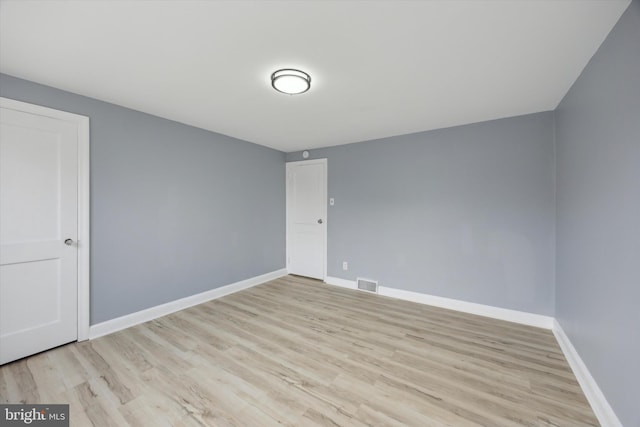 empty room featuring light hardwood / wood-style floors