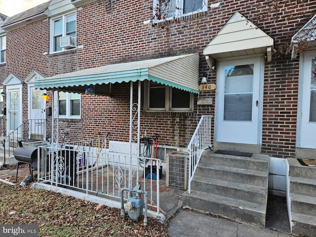 doorway to property featuring cooling unit