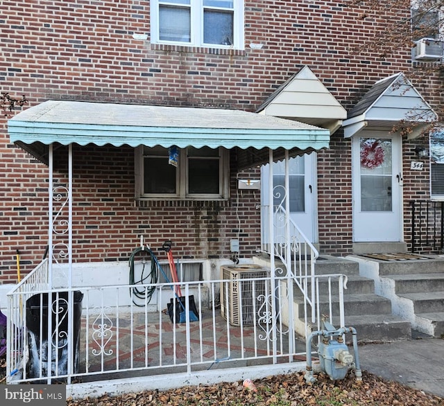 view of exterior entry with central AC