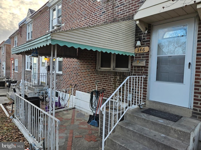 exterior entry at dusk with cooling unit