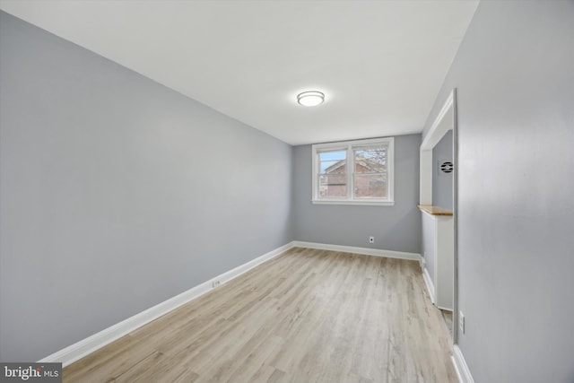 spare room featuring light hardwood / wood-style flooring