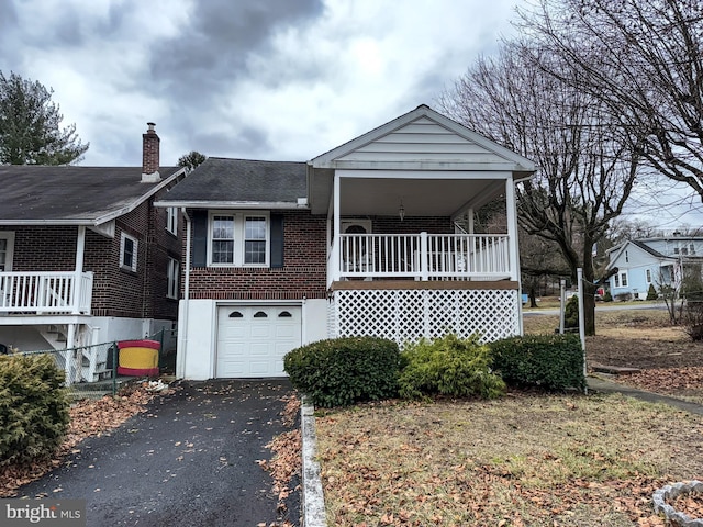 view of front of home with covered porch and a garage