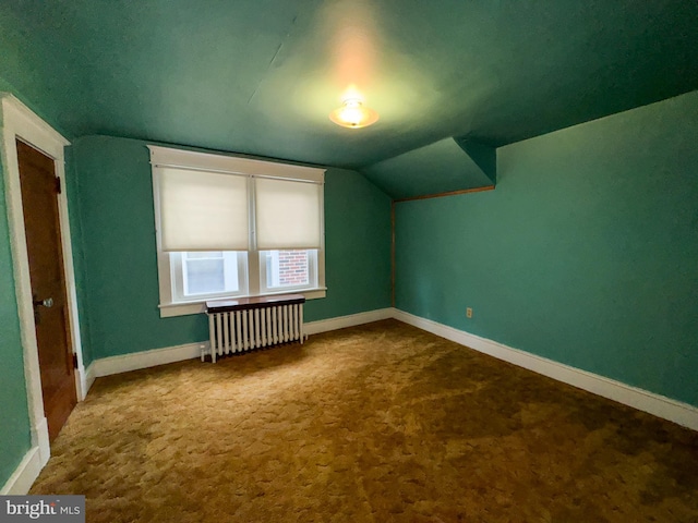 bonus room with radiator, carpet, and lofted ceiling