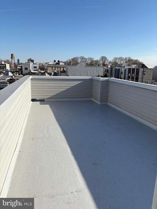 view of patio featuring a balcony