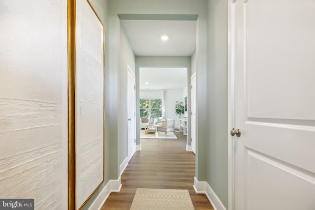 hall with dark hardwood / wood-style floors