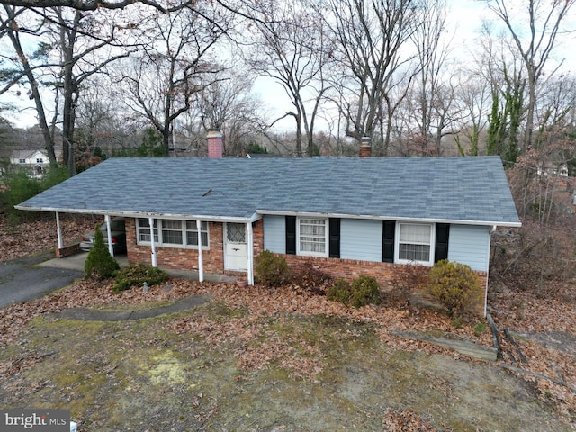 ranch-style house with a carport