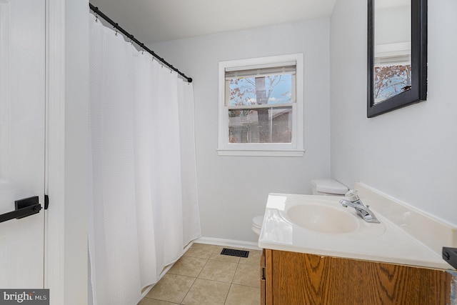 full bath featuring vanity, visible vents, baseboards, tile patterned flooring, and toilet