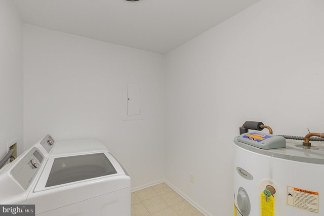 laundry area featuring baseboards, laundry area, water heater, and washing machine and clothes dryer