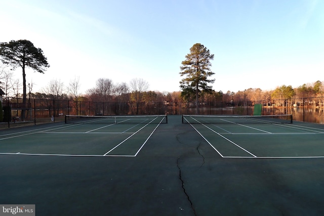 view of tennis court with fence