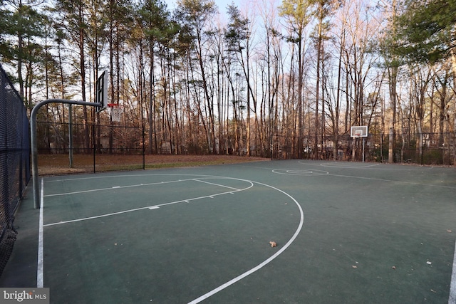 view of sport court with community basketball court and fence