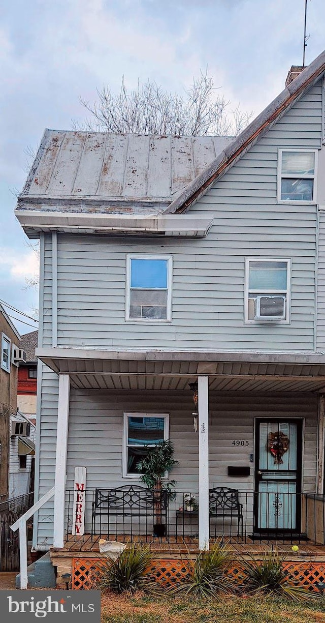 exterior space with cooling unit and covered porch