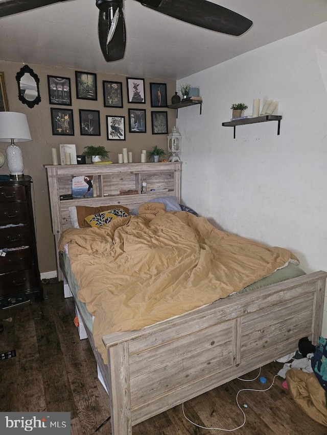 bedroom featuring dark wood-type flooring