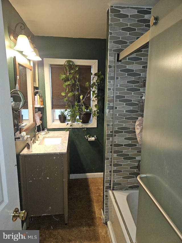 bathroom featuring a tub to relax in and vanity