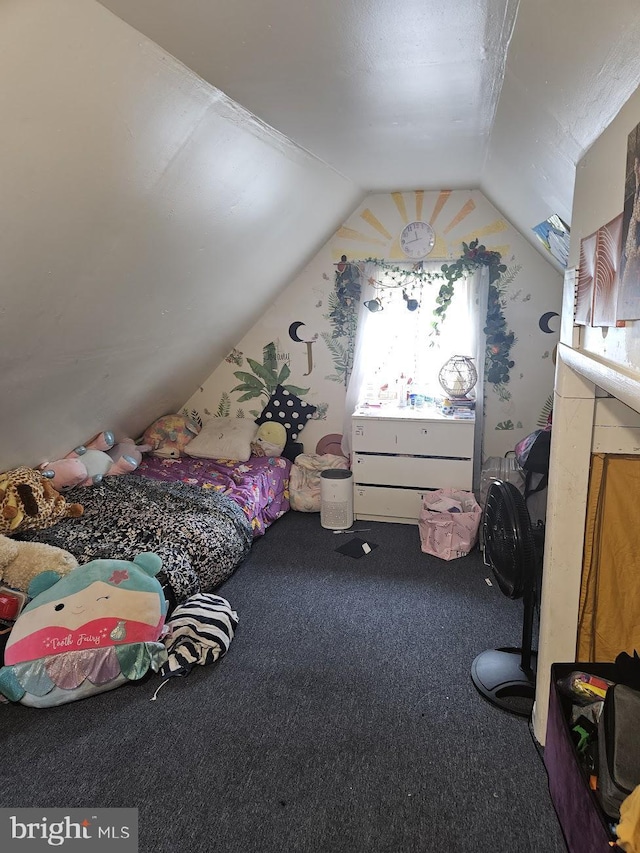 carpeted bedroom with lofted ceiling