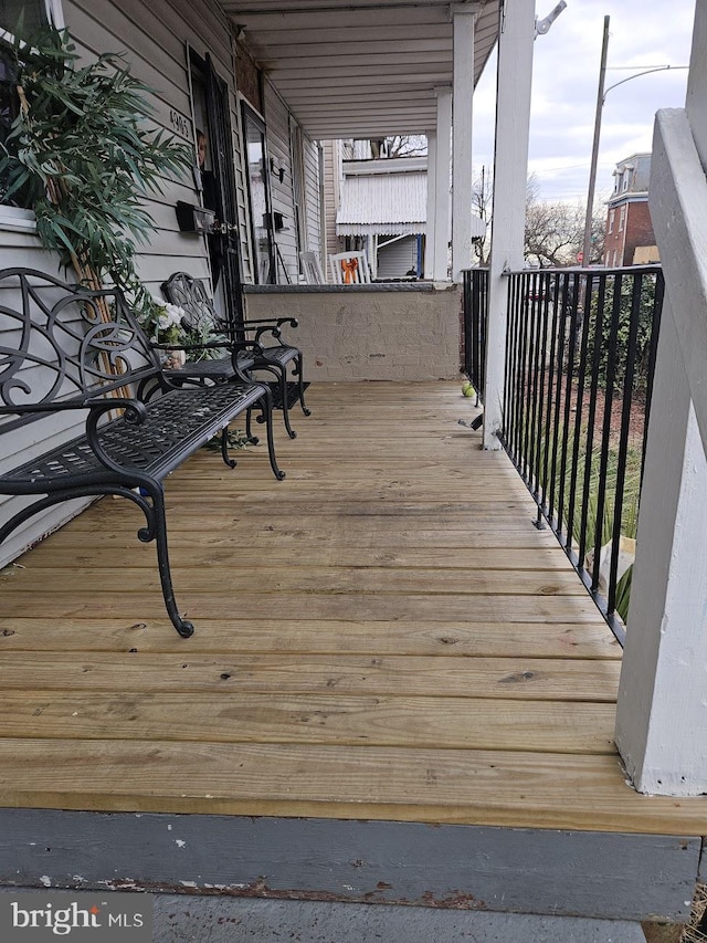 wooden terrace featuring a porch