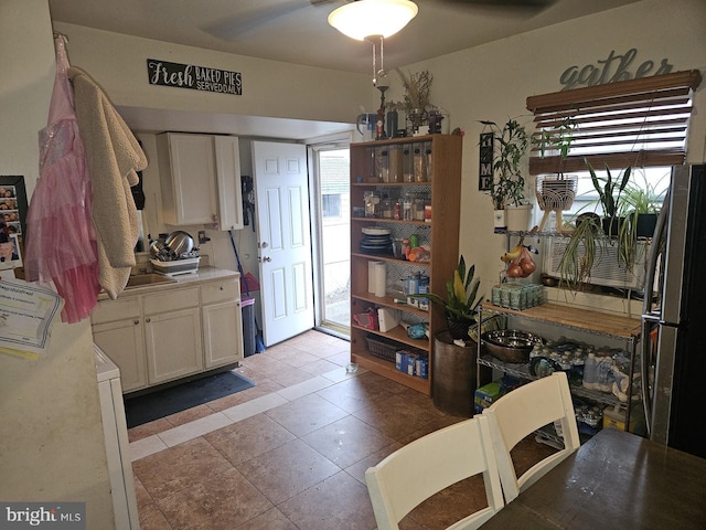 dining area with light tile patterned floors