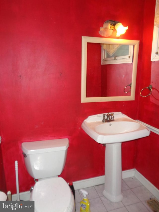 bathroom featuring tile patterned floors and toilet