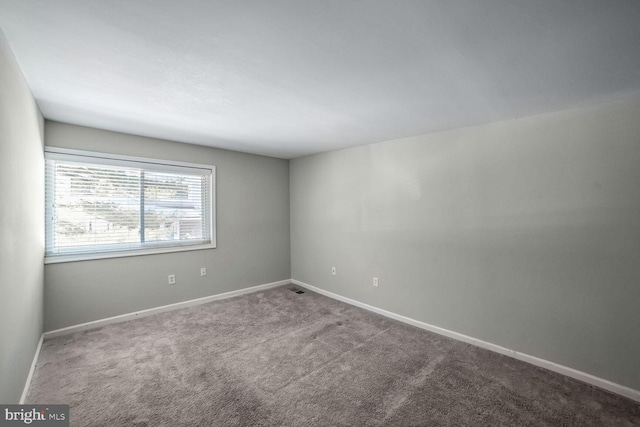 empty room featuring carpet flooring